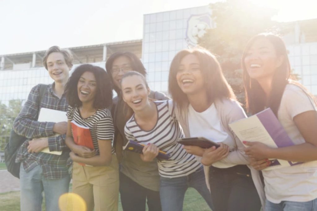 Group of college students smiling and laughing